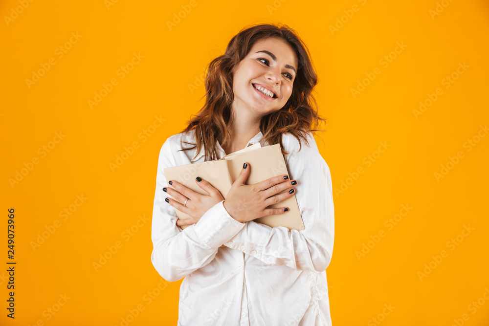 Portrait of a cheerful young woman wearing white shirt Portrait of a cheerful young woman wearing white shirt