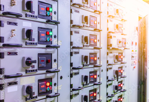 Electrical switch gear ,Digital meter at Low Voltage motor control center cabinet  in coal power plant. blurred for background.