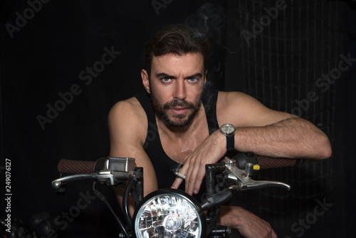 Fashion portrait of young handsome and sexy biker man.