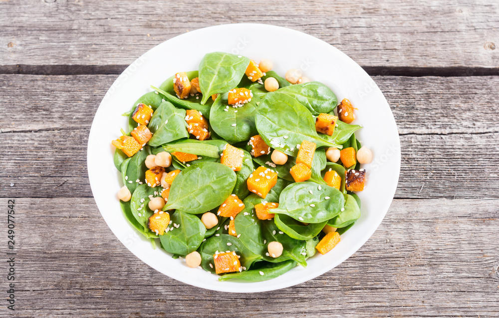 autumn salad with pumpkin , spinach , chickpea and sesame autumn salad with pumpkin , spinach , chickpea and sesame