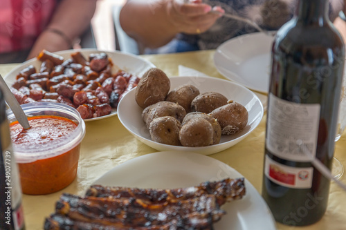 Potatoes, sausages and ribs ready to eat