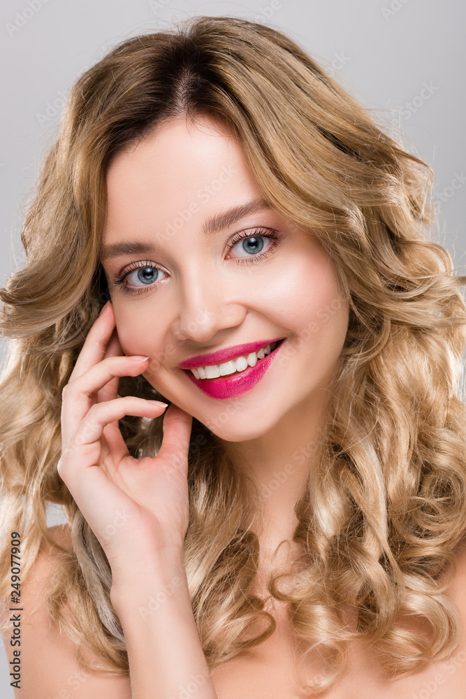 close up of tender nude smiling young woman posing isolated on grey close up of tender nude smiling young woman posing isolated on grey