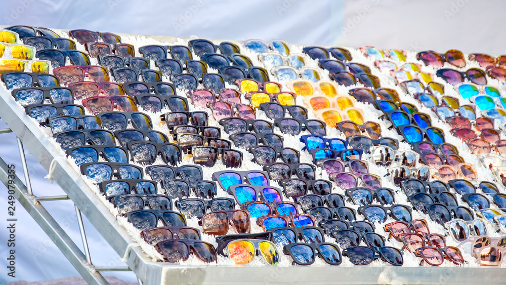 Obraz premium Sunglasses displayed on stall