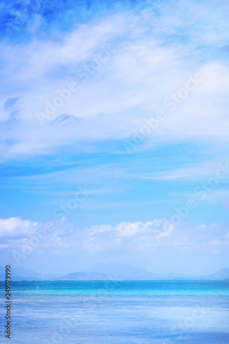 Beautiful ocean scene view isolated with light blue sky background, concept of vacation and sea travel, copy space