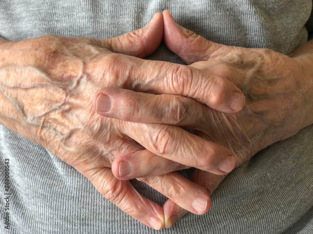 Fototapeta premium closeup wrinkled hands of a senior person