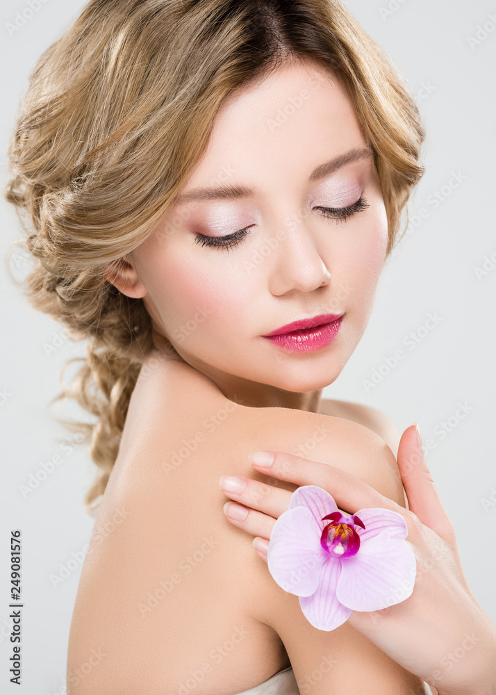 beautiful tender girl holding flower isolated on grey beautiful tender girl holding flower isolated on grey