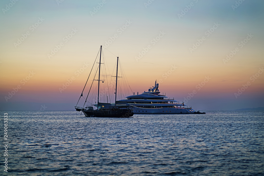 Luxurious boats, yachts and sailboats, in the old port of Chora in Mykonos