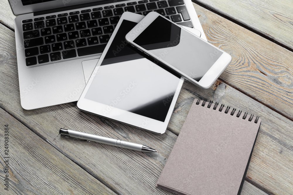 Open laptop with digital tablet and smartphone close up Open laptop with digital tablet and smartphone close up