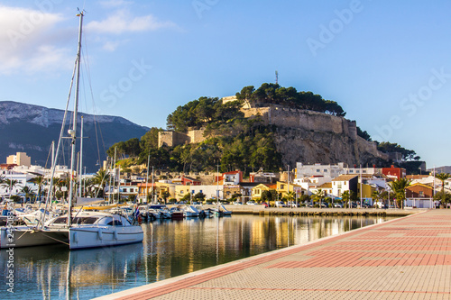 Panoramic view of Denia Port Marina promenade and Castle photo