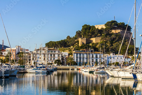 Panoramic view of Denia Port Marina promenade and Castle photo