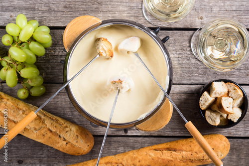 Cheese fondue with bread wine and grape