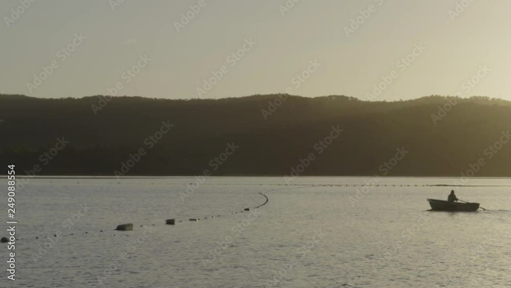 Slow motion on man rowing his boat Slow motion on man rowing his boat