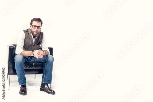 guy sitting on armchair