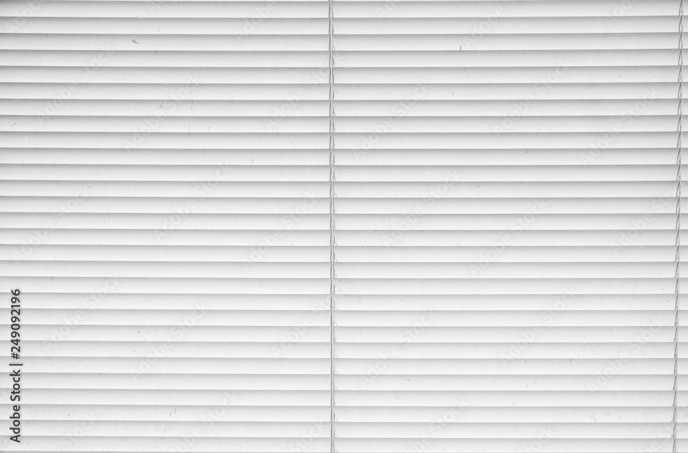 Fototapeta premium Window with closed metallic blinds, view from inside