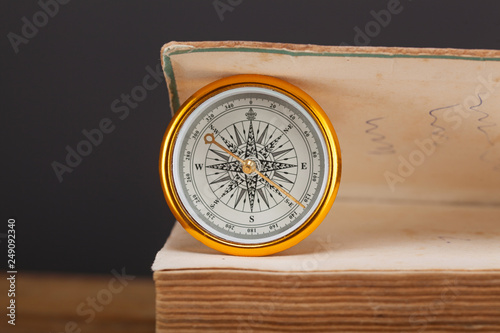 compass on wooden table photo