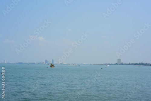 Close-up photos of small fishing boats at the fishing fishing port, Bang Saray Subdistrict, Sattahip District, Chonburi Province. Fishing boat view, sky and sea on a bright day	 photo