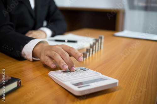 Businessmen calculate earnigs business performance, business concept. photo