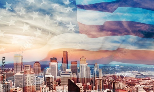 American flag on city background.