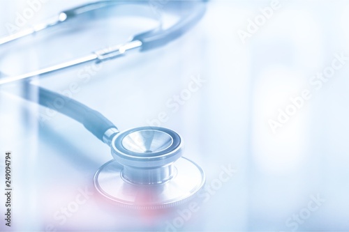 Medical doctor's stethoscope on table background