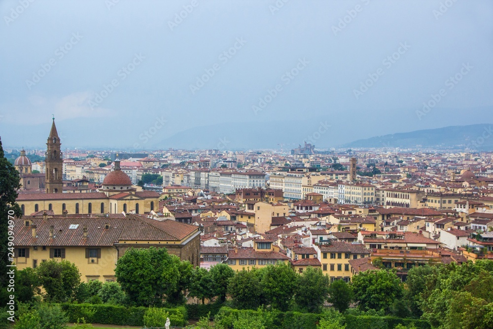 View of the city of Florence from the Boboli gardens, cloudy and rainy weather. Florence, Italy.