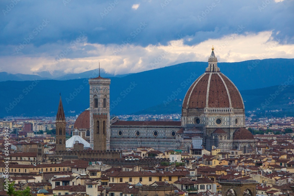 Cathedral of Santa Maria del Fiore (Duomo) in the evening. Florence Duomo with dramatic dark blue sky. Florence cityscape, view from Piazzale Michelangelo. Florence, Italy.