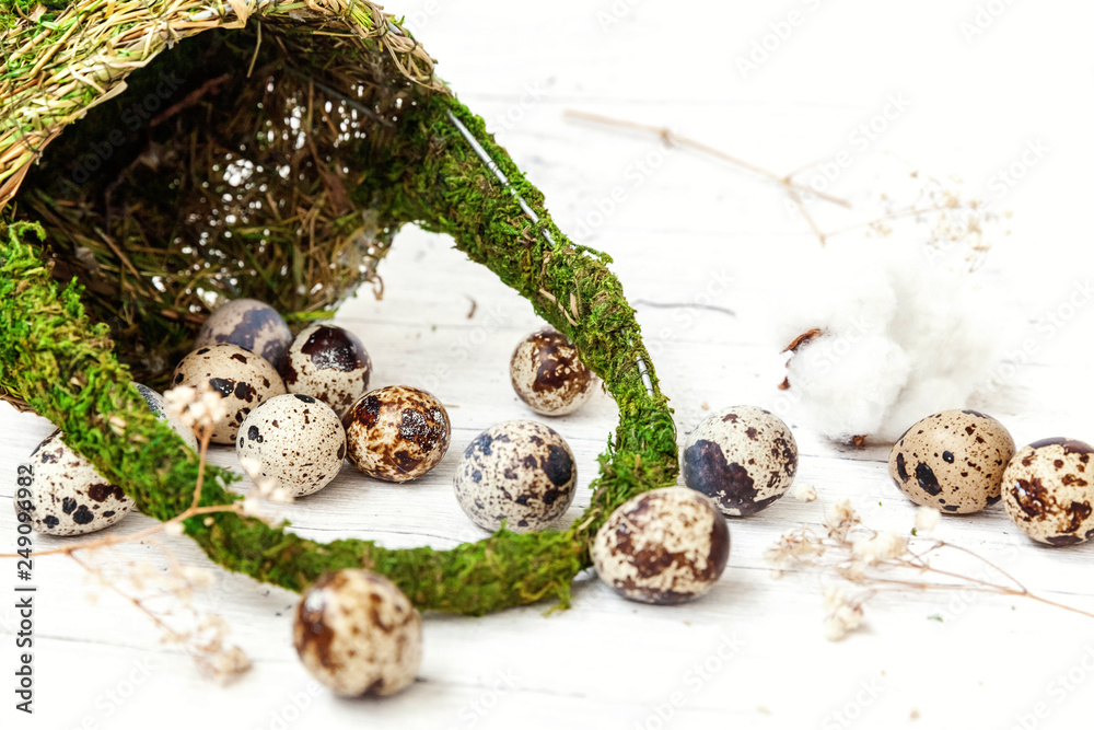 Easter decoration with eggs and basket on white wooden background. Easter egg hunt concept. Flat lay top view copy space. Spring greeting card Easter decoration with eggs and basket on white wooden background. Easter egg hunt concept. Flat lay top view copy space. Spring greeting card