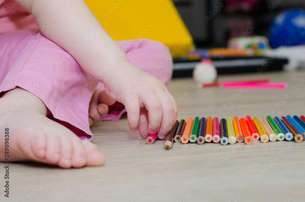 child playing with colored pencils child playing with colored pencils