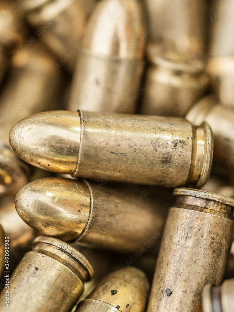 Top close-up macro view of large group of gun bullets