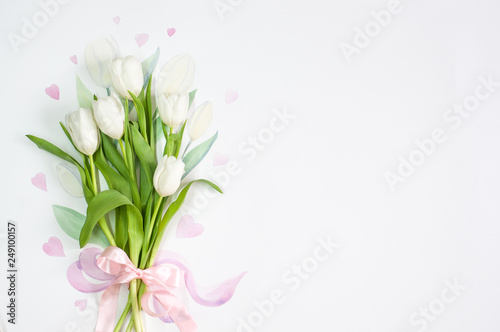 Fototapeta Naklejka Na Ścianę i Meble -  Background for postcards. White tulips with love.