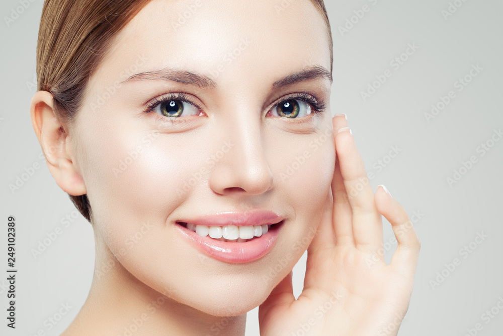 Closeup portrait of beautiful model face. Pretty girl with clear skin Closeup portrait of beautiful model face. Pretty girl with clear skin
