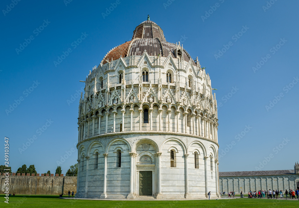 Pisa Baptistery tower and blue sky background, Toscana province, Italy.