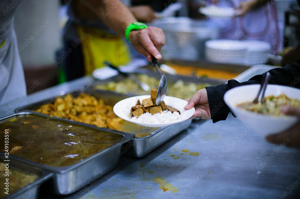 Fototapeta premium Free food distribution is social activity for helping the homeless people by giving them food.