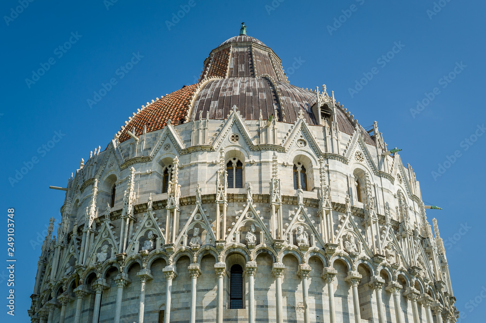 Fototapeta premium Pisa Baptistery historic tower upper sections close view. Toscana region, Italy