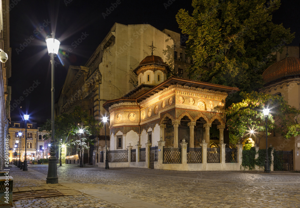 Bucharest old city centre panorama view. Stavropoleos Church by night. Old town tourist attraction in Romania