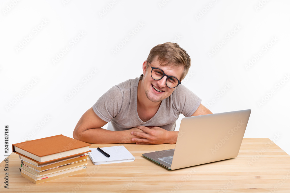 Study, education, people concept - man doing exercises in laptop, looking amazed