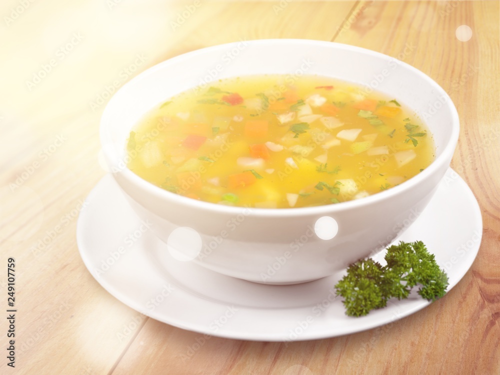 Bowl of delicious vegetables soup on  table