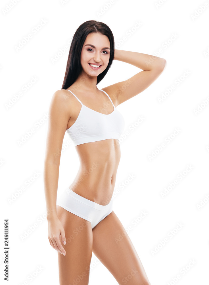 Fototapeta premium Young, fit and beautiful brunette girl in white swimsuit.