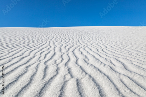 Looking up a dune at the rippled sand, in White Sands National Monument