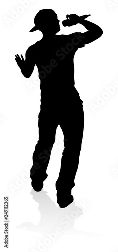 A singer pop, country music, rock star or hiphop rapper artist vocalist singing in silhouette