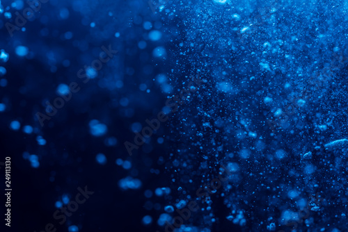 Abstract Blue bokeh defocus glitter blur background.