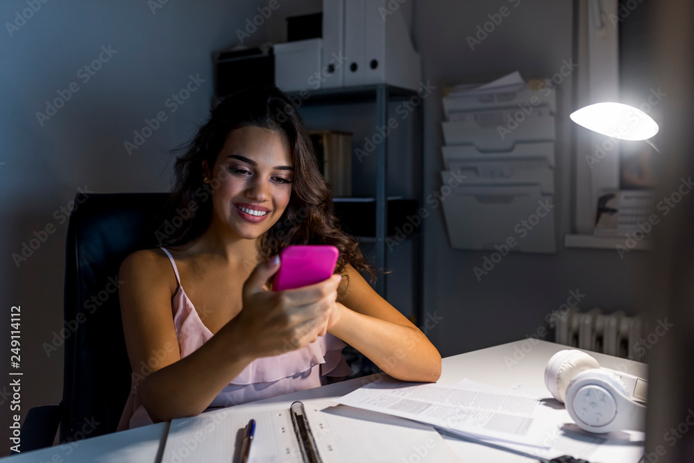 Business woman typing text message on smart phone Business woman typing text message on smart phone