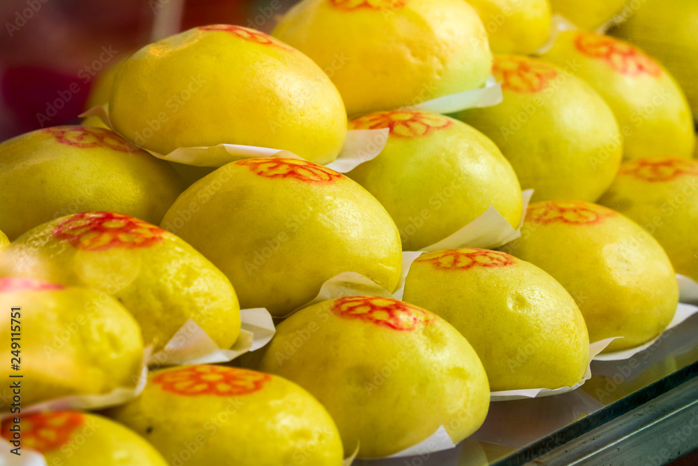 Yellow buns are steaming hot in oven Yellow buns are steaming hot in oven