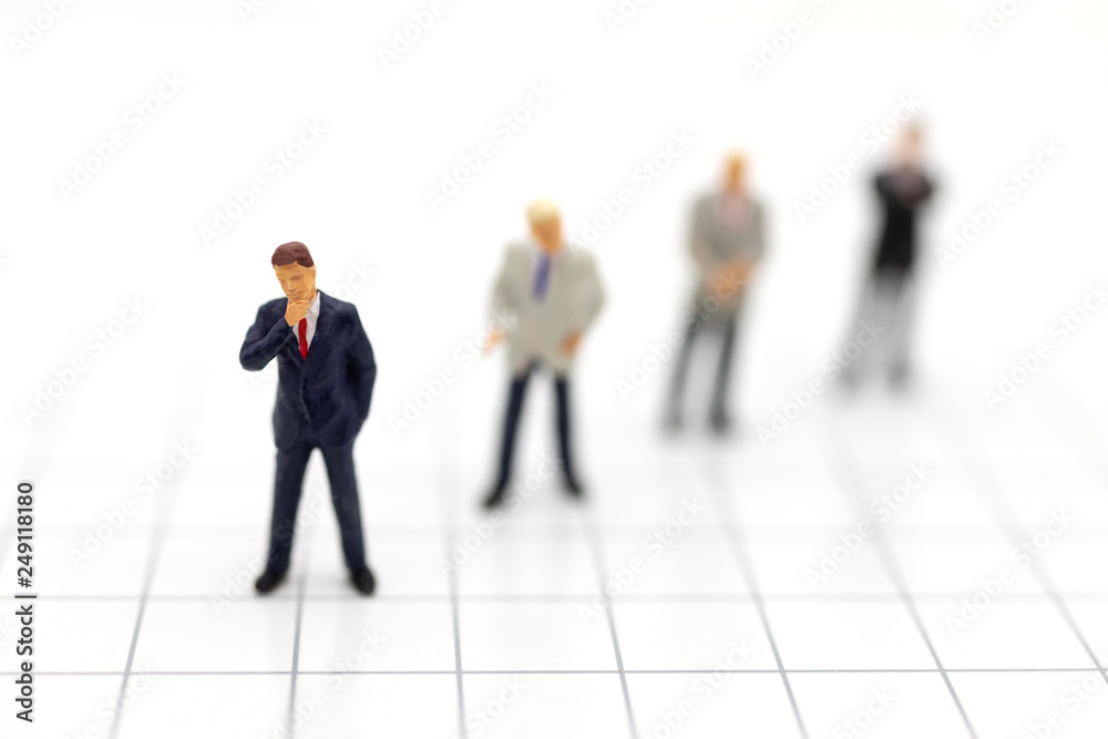 Miniature people, Group of businessmen work with team, using as background Choice of the best suited employee, HR, HRM, HRD, job recruiter concepts. Miniature people, Group of businessmen work with team, using as background Choice of the best suited employee, HR, HRM, HRD, job recruiter concepts.