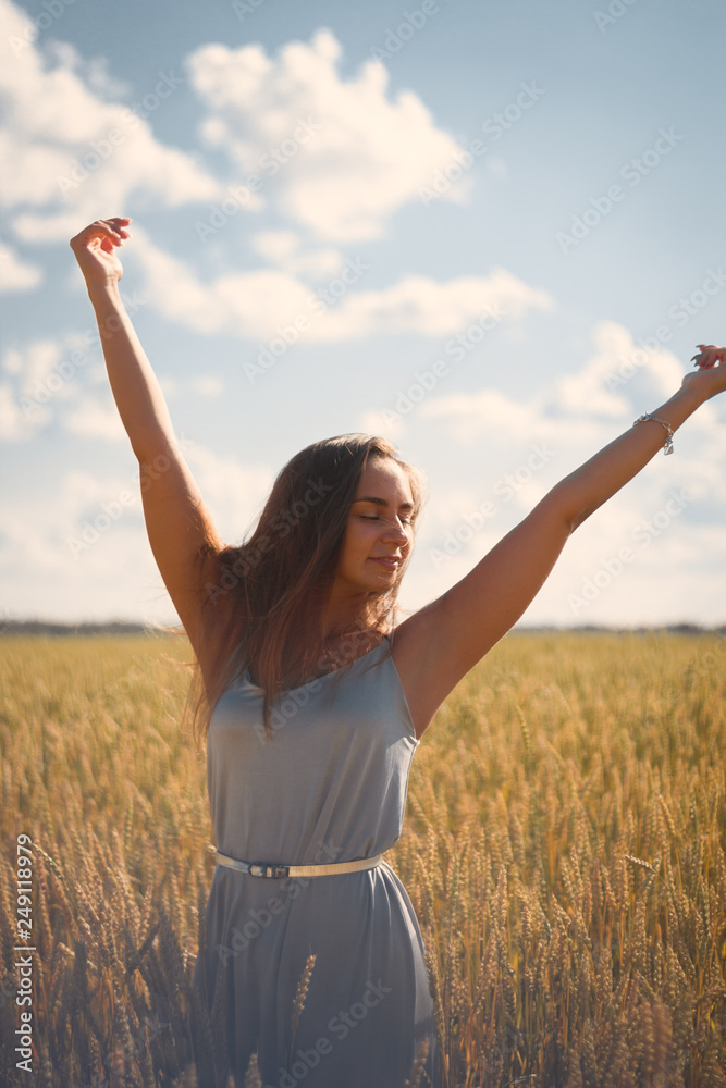 beautiful woman in silver dress on a field beautiful woman in silver dress on a field