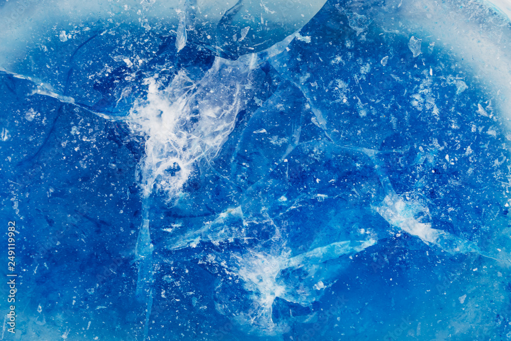 Fototapeta premium Blue ice with cracks and rifts