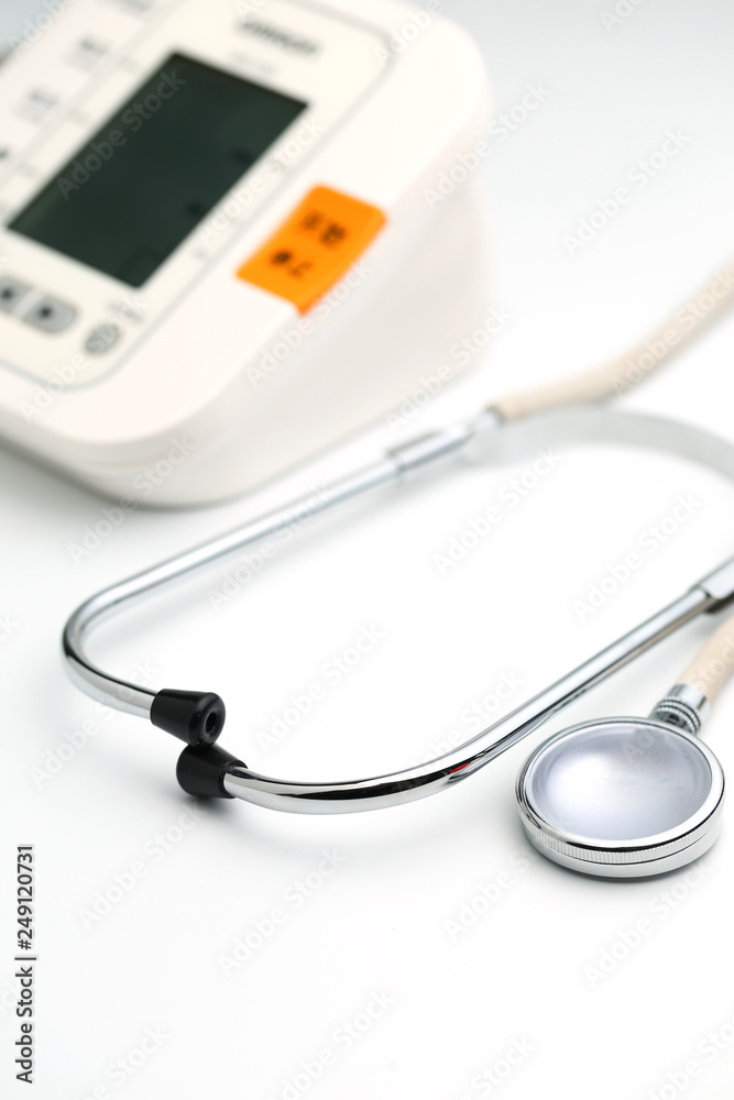 Stethoscope with Electronic Blood Pressure Monitor or Sphygmomanometer on the white background. Healthcare concept. Stethoscope with Electronic Blood Pressure Monitor or Sphygmomanometer on the white background. Healthcare concept.