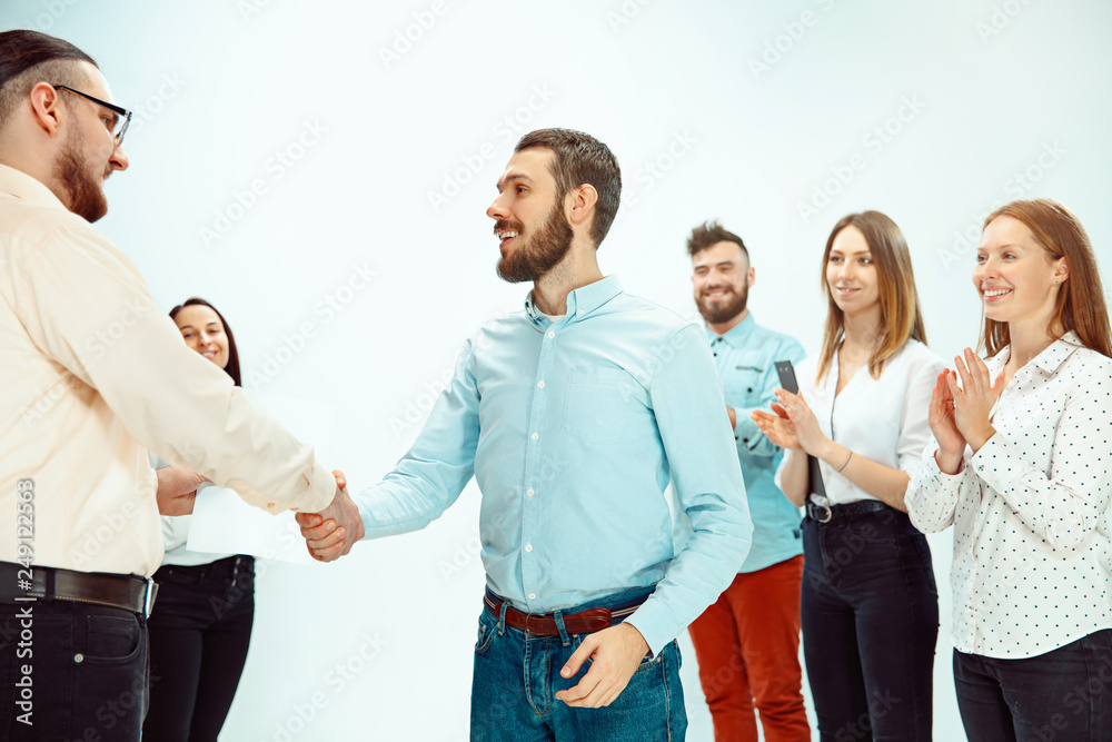 Boss approving and congratulating young successful employee of the company for his successes and good work. National Employee Appreciation Day, businesswoman, businessman, business, success, admire Boss approving and congratulating young successful employee of the company for his successes and good work. National Employee Appreciation Day, businesswoman, businessman, business, success, admire