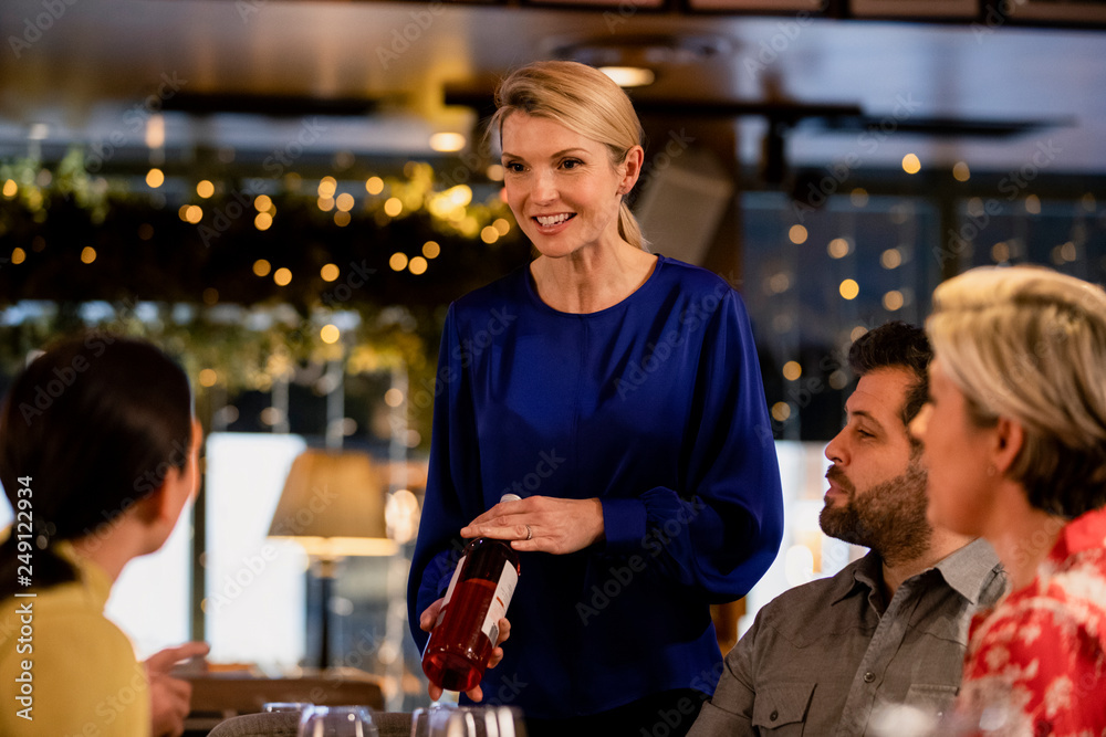Waitress Reccomending a Wine