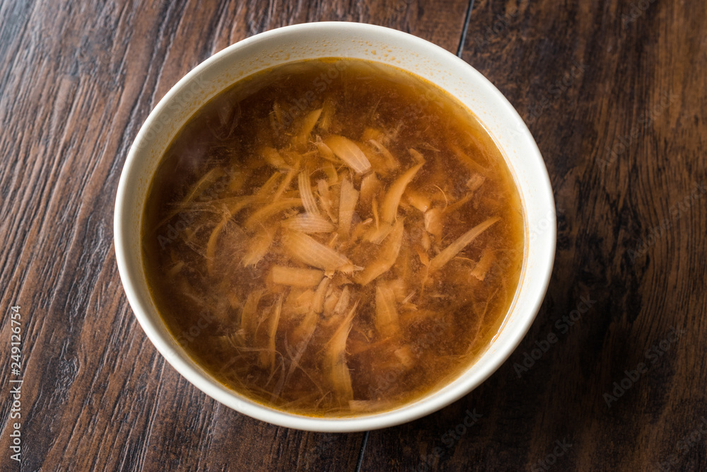 French Onion Soup with Bread on Dark Wooden Surface. French Onion Soup with Bread on Dark Wooden Surface.