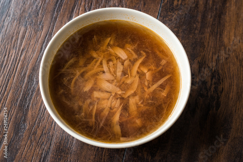 French Onion Soup with Bread on Dark Wooden Surface.